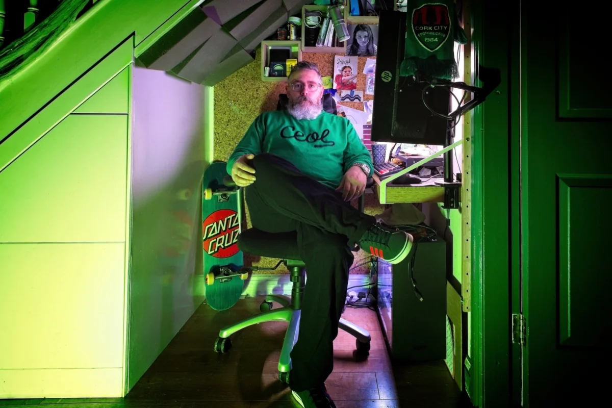 John Henry Donovan sitting beneath stairs.